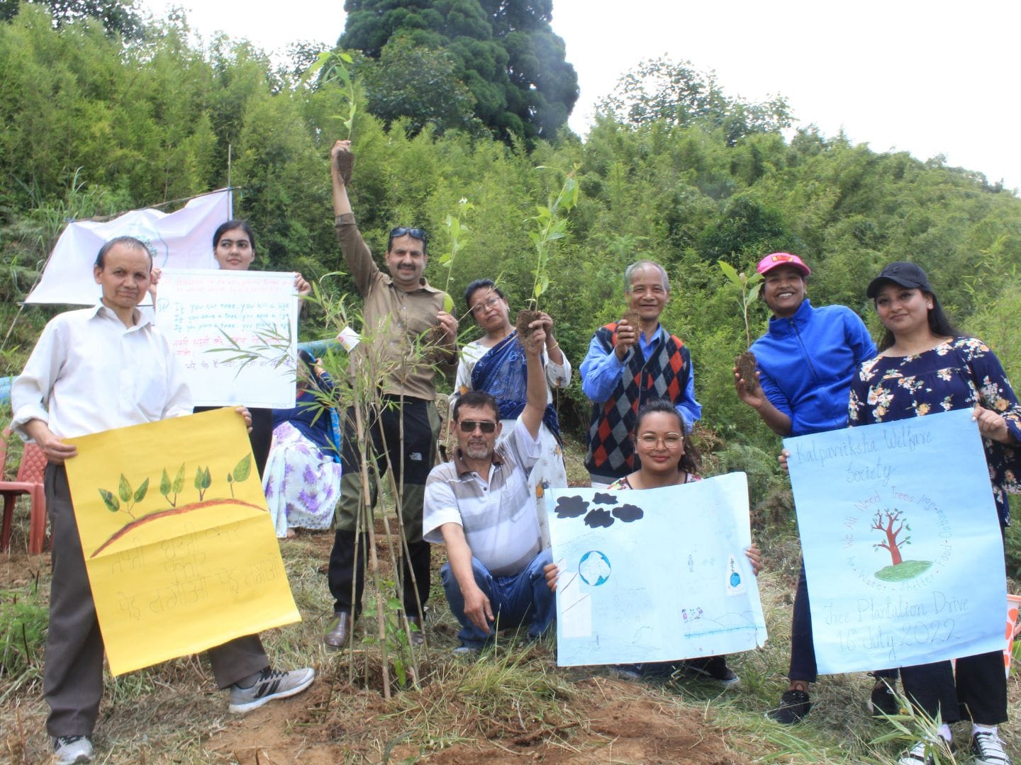 Image showing people planting trees on a nature care campaign by Kalpavriksha Welfare Society a NGO in Darjeeling.