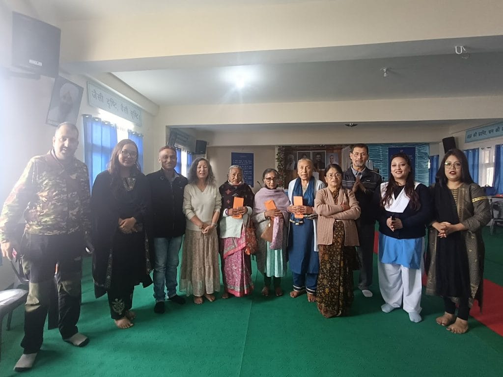 Image showing helping senior citizens with funds on a Elder care campaign by Kalpavriksha Welfare Society a NGO in Darjeeling.